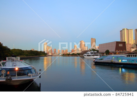 Waterside cityscape Waters bamboo turf and dock evening view 84725941