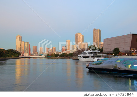 Waterside cityscape Waters bamboo turf and dock evening view 84725944