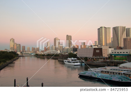 Waterside cityscape Waters bamboo turf and dock evening view 84725953