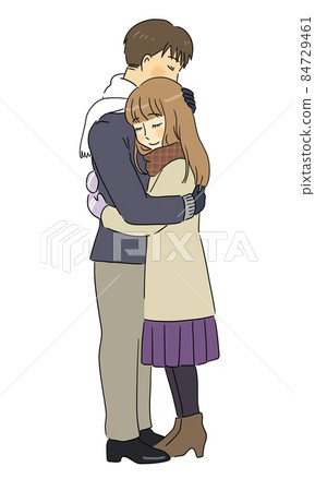 A couple of men and women hugging each other in winter 84729461