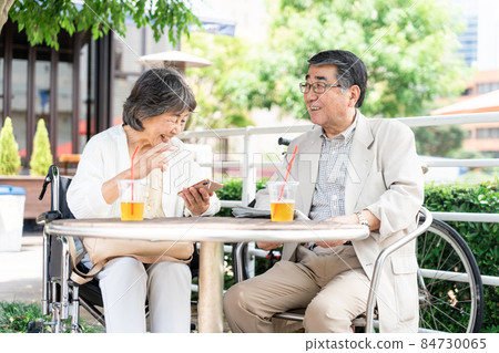Senior couple wheelchair date Senior couple wheelchair date 84730065