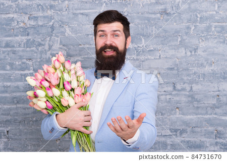 Womens day. Flower for March 8. Bearded man Womens day. Flower for March 8. Bearded man 84731670