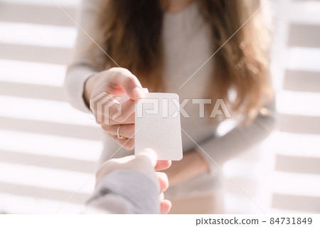 Exchanging business cards for business 84731849