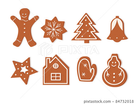 A set of Christmas gingerbread cookies of different shapes. Delicious New Year's dessert, festive curly cookies with icing 84732018