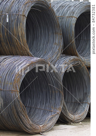 Thin metal reinforcement wound into bays at the metal products warehouse Thin metal reinforcement wound into bays at the metal products warehouse 84732381