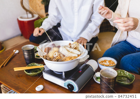 Young people having a home party 84732451