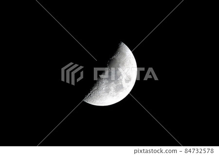 Partial moon against a black sky 84732578