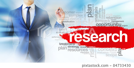 Businessman shows Research word cloud, business concept background 84733430