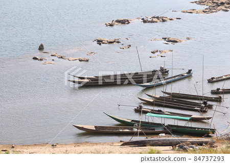 Small fishing boats resting in river Small fishing boats resting in river 84737293