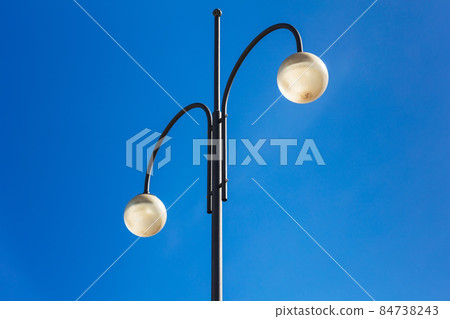 street lights on high steel pillars and sky 84738243