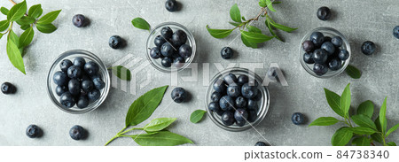 Fresh berry concept with blueberry on gray textured table Fresh berry concept with blueberry on gray textured table 84738340