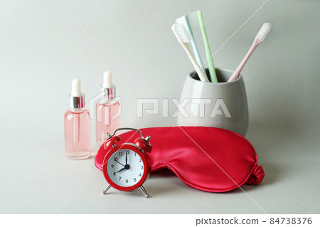 Female sleep routine accessories on gray background Female sleep routine accessories on gray background 84738376