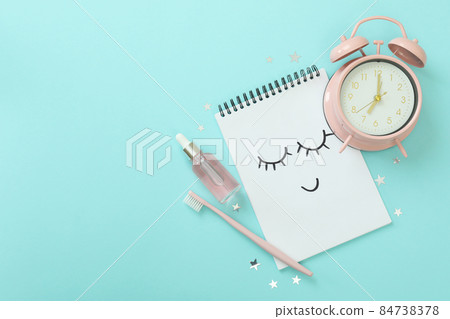 Female sleep routine accessories on blue background Female sleep routine accessories on blue background 84738378