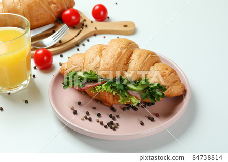Concept of tasty eating with croissant sandwich, close up 84738814