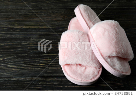 Pair of house slippers on wooden background 84738891