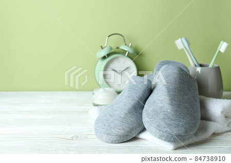 Sleep routine accessories on white wooden table 84738910