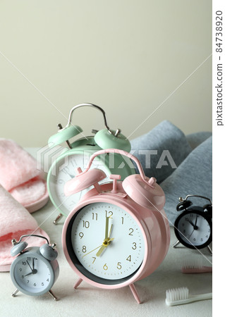 Different sleep routine accessories on white textured table 84738920