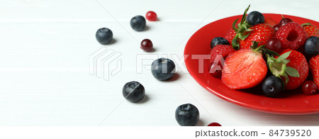 Plate with berry mix on white wooden background Plate with berry mix on white wooden background 84739520