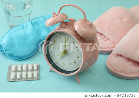 Female sleep routine accessories on blue background Female sleep routine accessories on blue background 84739735