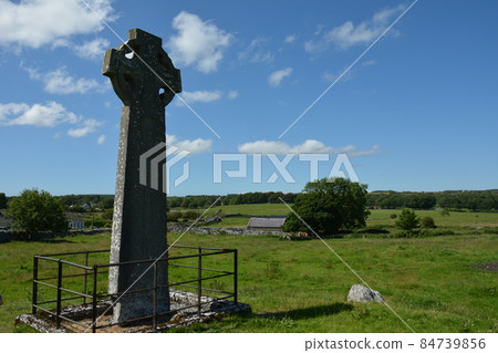 KILFENORA, COUNTY CLARE, IRELAND, August 19th 2019: Old high cross in Kilfenora Ireland, the city of the crosses. Kilfenora, Ireland KILFENORA, COUNTY CLARE, IRELAND, August 19th 2019: Old high cross in Kilfenora Ireland, the city of the crosses. Kilfenora, Ireland 84739856