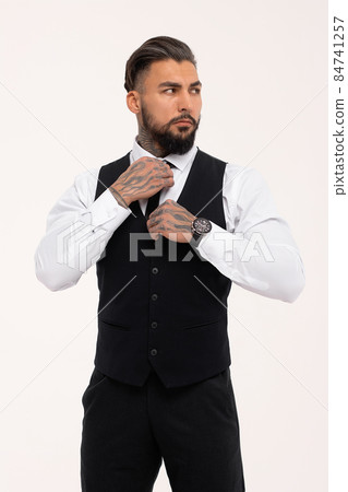 Tattooed male model in formal clothes with tie Tattooed male model in formal clothes with tie 84741257
