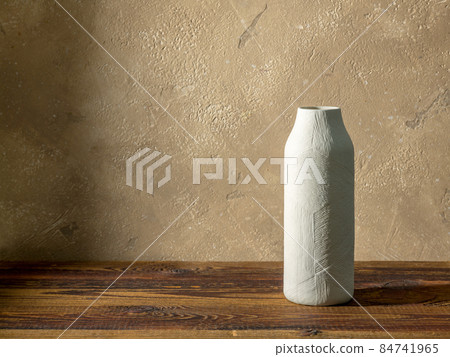 white vase on wooden table 84741965