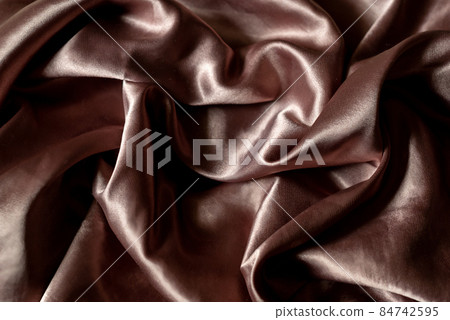 Pale pink color of crumpled silk fabric, textile background Pale pink color of crumpled silk fabric, textile background 84742595