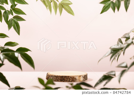 Wood slice podium on pink background for cosmetic product mockup 84742784