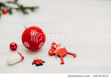 Christmas Red Decorations on a White Wooden Table with Copy Space Christmas Red Decorations on a White Wooden Table with Copy Space 84742919