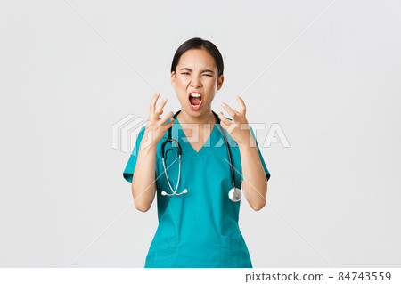 Covid-19, healthcare workers and preventing virus concept. Angry pissed-off asian female nurse, doctor losing temper, stressed-out physician shouting in anger, looking mad and aggressive Covid-19, healthcare workers and preventing virus concept. Angry pissed-off asian female nurse, doctor losing temper, stressed-out physician shouting in anger, looking mad and aggressive 84743559