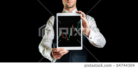 Shares financial. Businessman holding finance application for sell, buy and analysis profit dividend statistics. Investment business technology app on digital screen. Business graph background. 84744304
