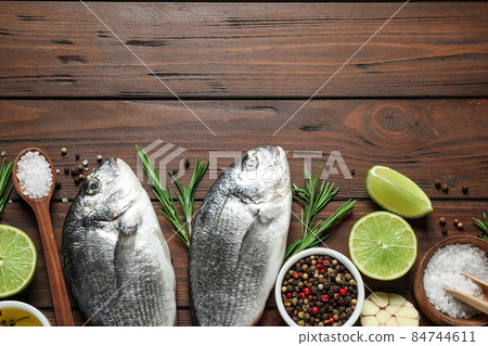 Flat lay composition with graphic drawing tablet and different office items on grey stone background 84744611