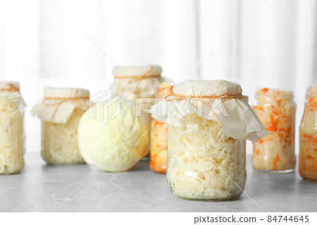 Flat lay composition with graphic drawing tablet and different office items on grey stone background Flat lay composition with graphic drawing tablet and different office items on grey stone background 84744645