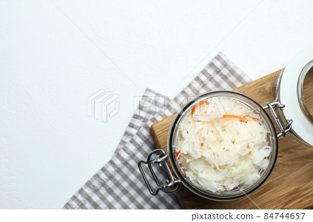 Flat lay composition with graphic drawing tablet and different office items on grey stone background 84744657