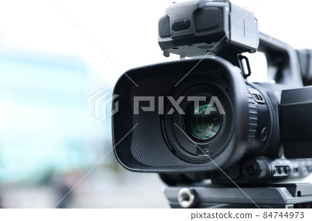 Professional video camera on city street, closeup Professional video camera on city street, closeup 84744973
