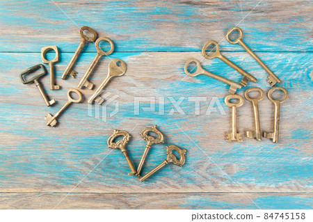 Old meal keys on wooden background Old meal keys on wooden background 84745158