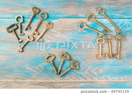Old meal keys on wooden background 84745159