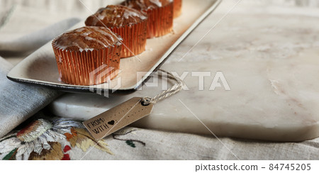 Sweet cakes on kitchen table 84745205