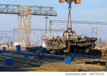Railway depot stations with industrial crane that raises the driving wheels for train Railway depot stations with industrial crane that raises the driving wheels for train 84745521