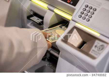 Female station buying tickets Female station buying tickets 84748082