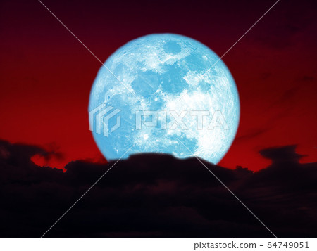 full harvest blue moon over dark heap cloud on night red sky full harvest blue moon over dark heap cloud on night red sky 84749051