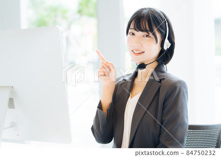 A woman with a headset A woman with a headset 84750232