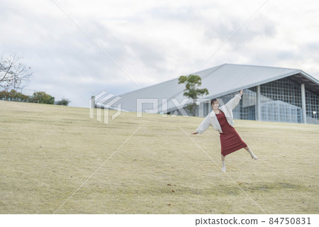 A woman in the park A woman in the park 84750831