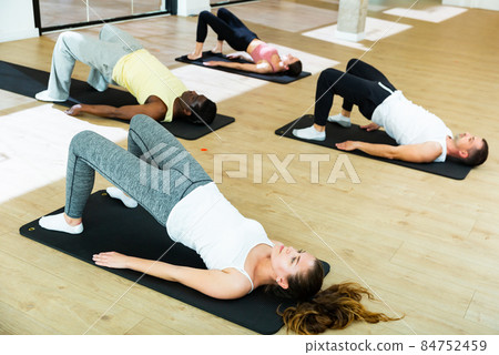 Sporty people practicing pilates at group class 84752459