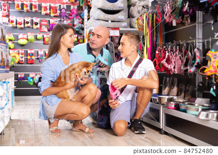 Nice family with teenage son choosing accessories Nice family with teenage son choosing accessories 84752480