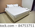 White single bed set and pillows and blankets of resort or hotel room, white room and free space in picture. 84753751