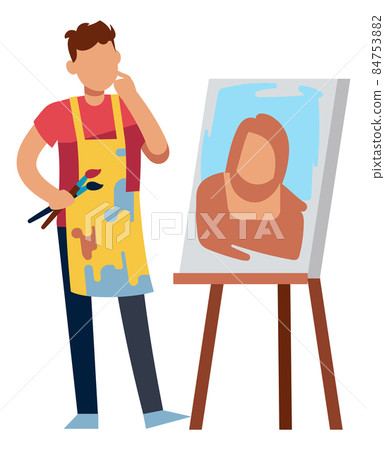 Artist drawing portrait. Man holding paintbrush and looking at canvas 84753882