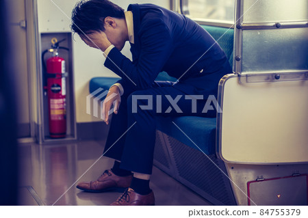 A man who is depressed in the train train A man who is depressed in the train train 84755379
