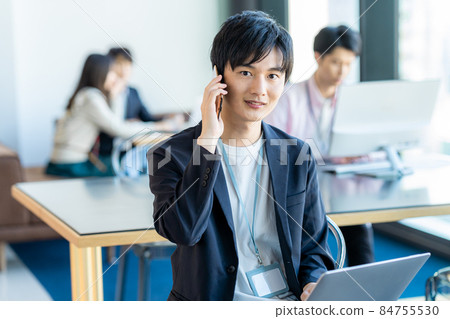 Young businessman in the office Young businessman in the office 84755530
