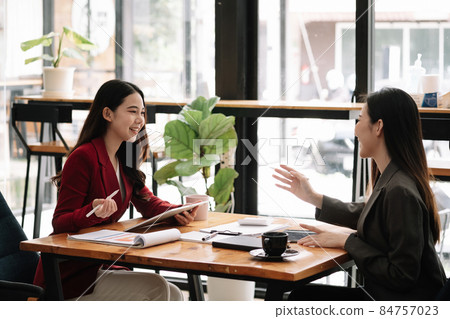 Happy Business Asian People Analyzing Statistics Business Documents, Financial Concept. Happy Business Asian People Analyzing Statistics Business Documents, Financial Concept. 84757023